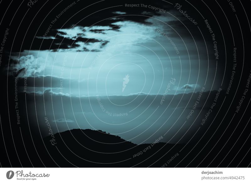 The last rays of light come through the cloud cover. The vast land is already shrouded in darkness. evening mood Sunset Sky Landscape Dusk Evening Exterior shot