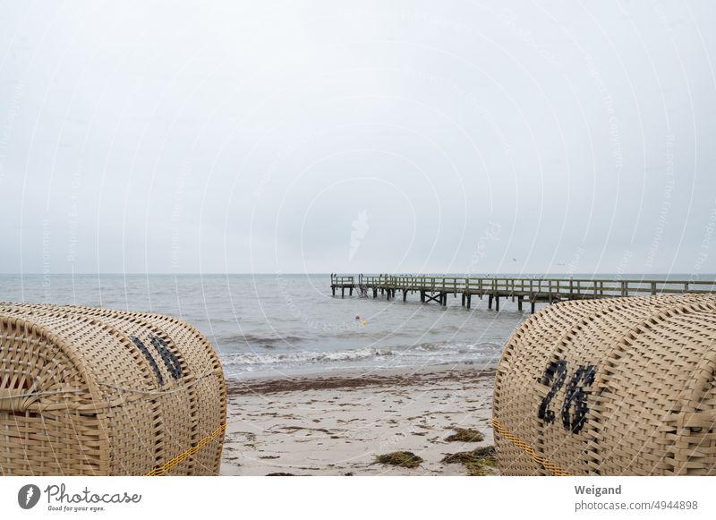 Jetty in the sea and beach baskets on the beach beach chairs Ocean Footbridge Baltic Sea North Sea Northern Germany Schleswig-Holstein Dreary wallpapers Nature