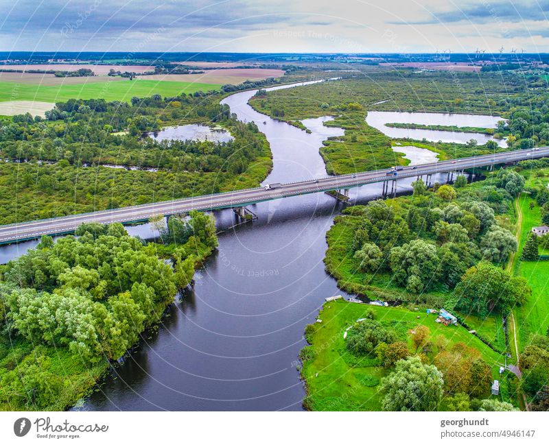 Long bridge over river with alluvial landscape, aerial view Sponge Peene Jarmen Bridge motorway bridge Highway Street Peat digging river landscape Landscape