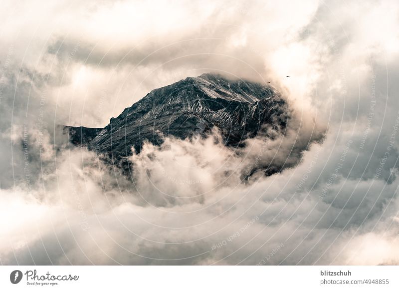 Cloud hole releases the mountain, 2 planes in the clouds Mountain Hiking Peak Rock Alps Environment Clouds Nature Landscape alpine panorama vacation Majestic