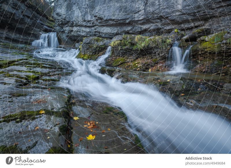 Fast waterfall on rocky slope brook flow fast autumn rough mountain huesca spain ordesa y monte perdido national park stream river creek nature rapid clean