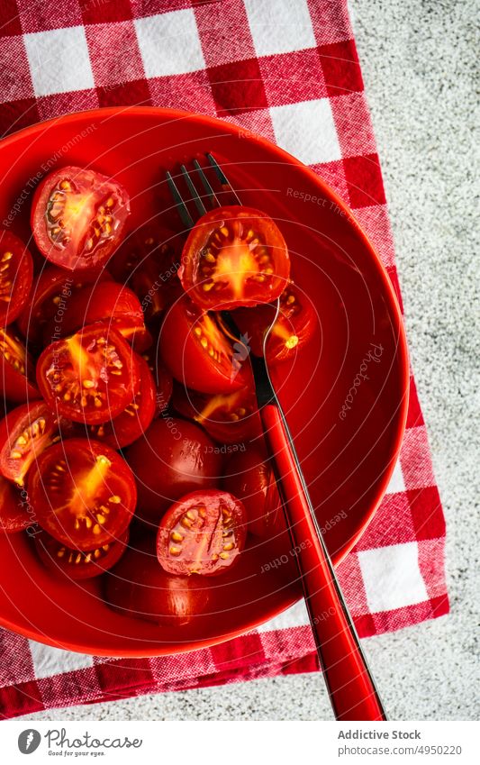 Ripe red cherry tomatoes in the bowl background concrete cook dinner eat eating food cut fresh healthy organic raw piece ripe salad seasonal served slice table