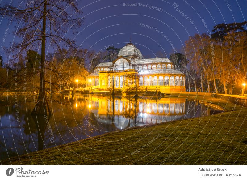 Illuminated palace at lake in night park architecture crystal glass illuminated landmark building attraction famous madrid spain europe capital heritage