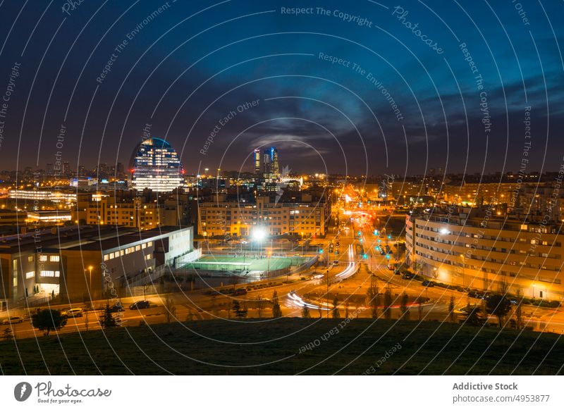 Night city with contemporary buildings and skyscrapers architecture night highway district cityscape urban madrid spain europe dark illumination tower evening