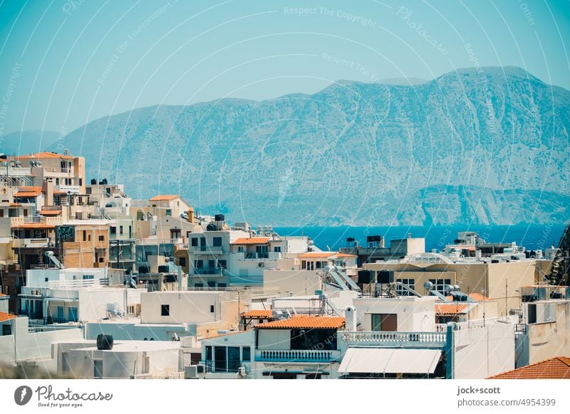 View over the city on the Gulf of Mirabello city view Small Town outlook Agios Nikolaos Crete Greece Mediterranean Cloudless sky cityscape Panorama (View)