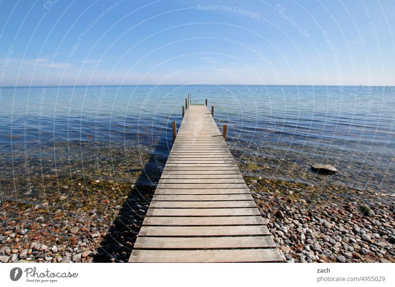 wrong track Footbridge Ocean Baltic Sea Water jetty Exterior shot Sky Nature coast Calm Beach Horizon Blue Wood Deserted Waves Line