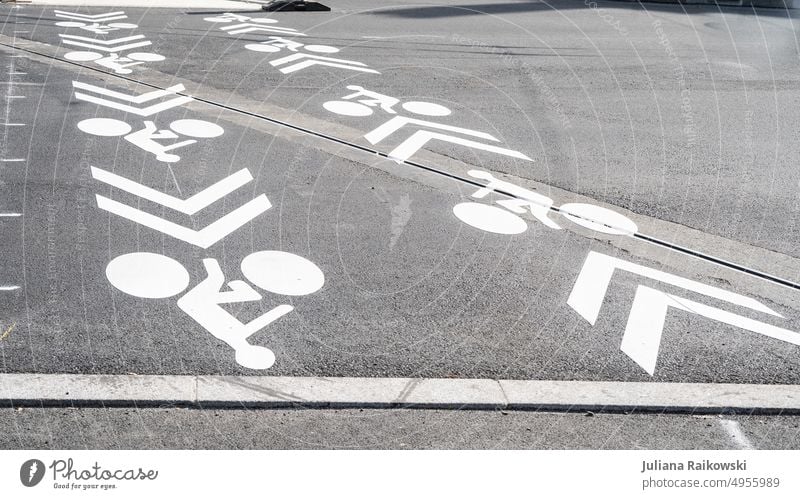 Bike lane markings on the road Deserted Cycling Beautiful weather Town Environmental protection Day means of locomotion Colour photo Sports Lifestyle Trip