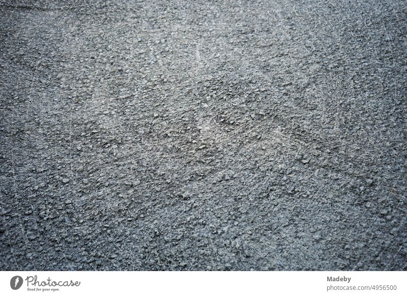 Rough texture plaster on the floor of the terrace of a country house in summer sunshine on the Black Sea coast in Inkumu in the province of Bartin on the Black Sea in Turkey in classic black and white