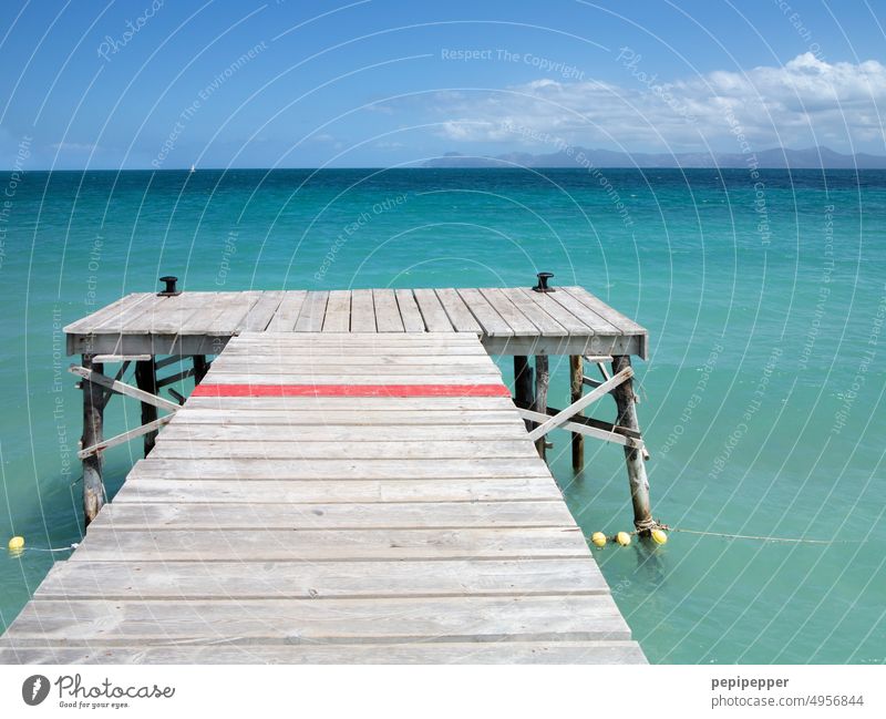 Wooden jetty to the sea wooden walkway Footbridge Nature Water Deserted Landscape Ocean Mediterranean Region Mediterranean sea Exterior shot Vacation & Travel