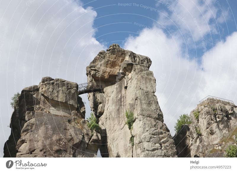 Externsteine - bizarre rock formation in sunlight against cloudy sky external stones Rock Distinctive Sandstone Teutoburg Forest North Rhine-Westphalia