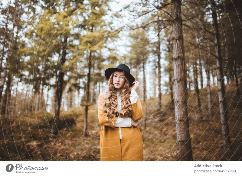 Young hipster woman in the countryside girl nature young person lifestyle hat summer model beauty hair outdoors casual fashion background caucasian natural face