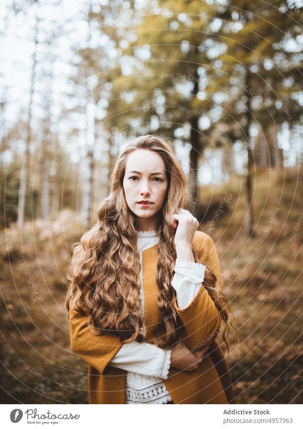 Young hipster woman in the countryside girl nature young person lifestyle hat summer model beauty hair outdoors casual fashion background caucasian natural face