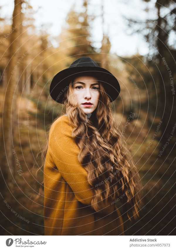 Young hipster woman in the countryside girl nature young person lifestyle hat summer model beauty hair outdoors casual background caucasian face stylish retro