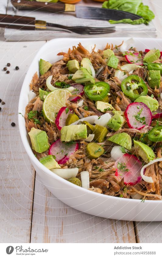 Cuban bowl with meat and slices of radish and jalapeno avocado lime delicious food pulled meat cuisine vegetable fresh piece cuban ingredient serve meal spicy