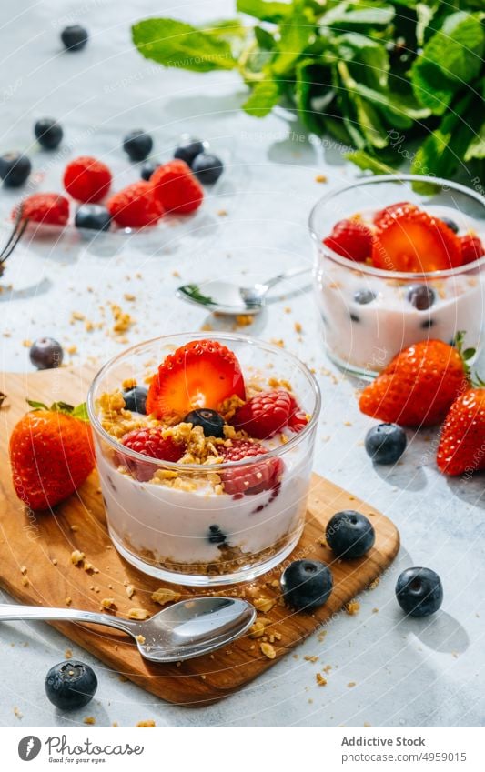 Strawberries and berries served with fresh yogurt sweet berry cream delicious fruit strawberry breakfast milk food creamy blueberry homemade bowl background