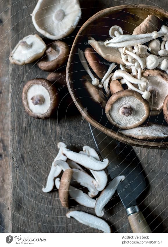 Shiitake mushrooms in bowl on table shiitake fresh wood organic full food gourmet ingredient cooking delicious vegetable many brown raw natural cuisine pile