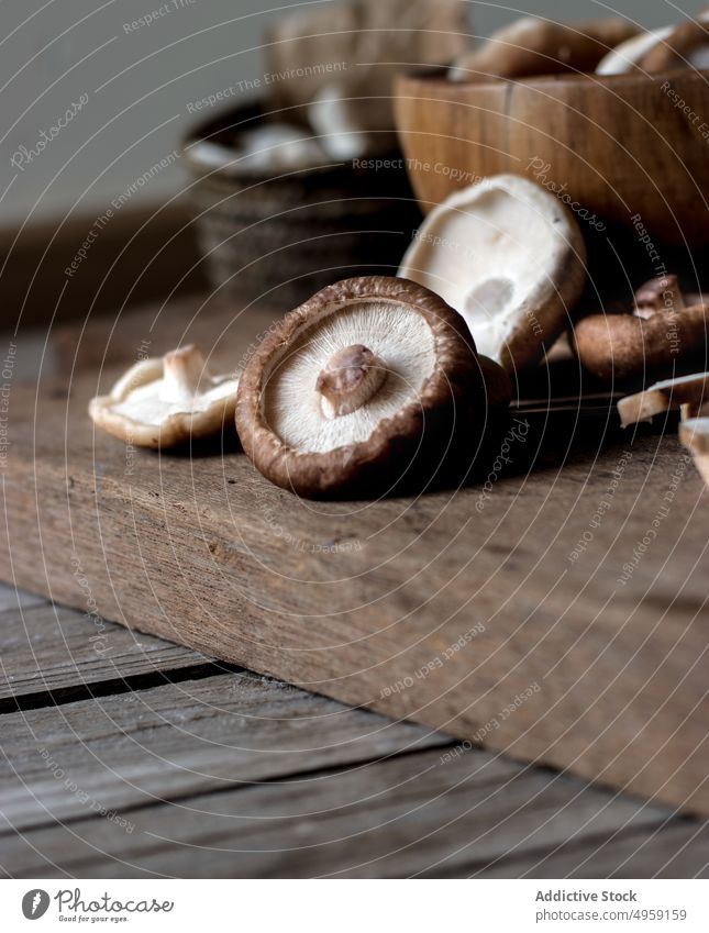 Shiitake mushrooms in bowl on table shiitake fresh wood organic full food gourmet ingredient cooking delicious vegetable many brown raw natural cuisine pile