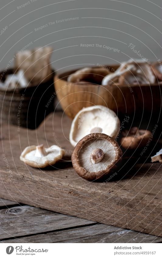 Shiitake mushrooms in bowl on table shiitake fresh wood organic full food gourmet ingredient cooking delicious vegetable many brown raw natural cuisine pile