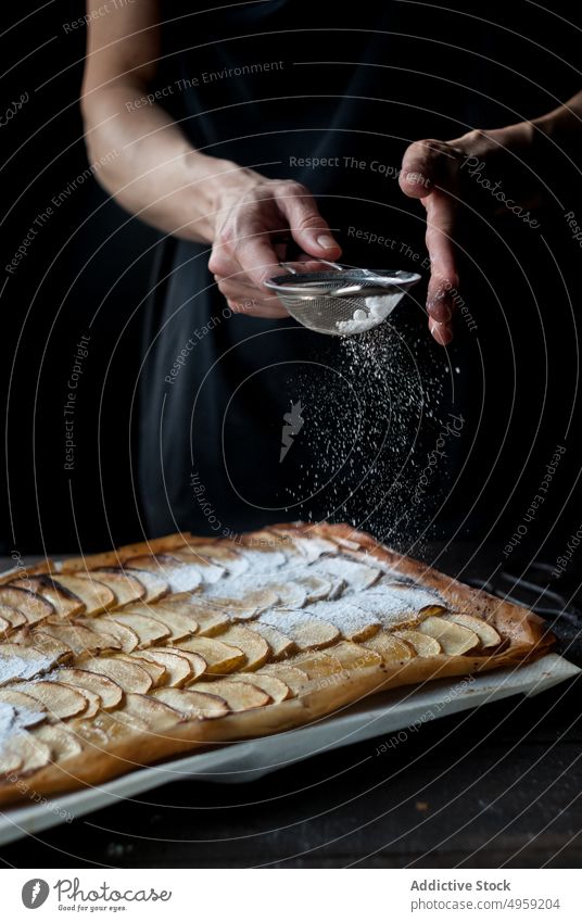 Crop baker sprinkling pie with powdered sugar bakery apple sprinkle cover dessert frangipane food fruit gourmet crust sweet delicious plate fresh sieve utensil