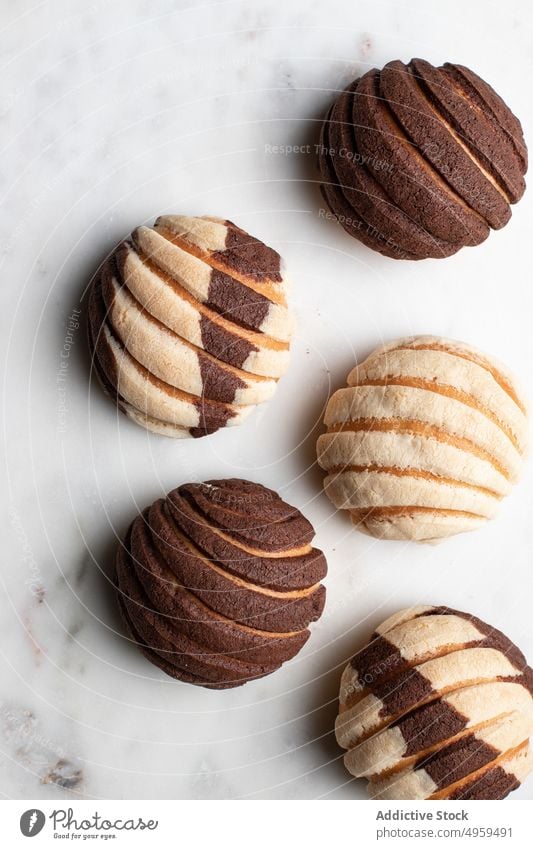 Tasty Mexican conchas on plate in kitchen bread roll sweet delicious tradition bakery dessert homemade tasty mexican food chocolate pastry yummy biscuit snack