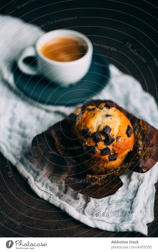 Chocolate muffins and coffee cup on dark background baked breakfast butter cake chocolate cupcake dessert food sweet fresh delicious tasty yummy calories snack