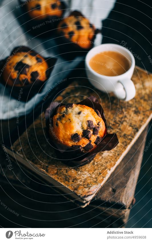 Chocolate muffins and coffee cup on dark background baked book breakfast butter cake chocolate cupcake dessert food sweet wooden fresh delicious tasty yummy