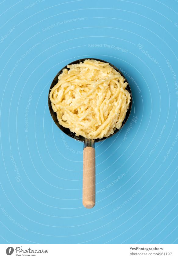 German pasta with cheese in a pan, above view on a blue table austrian background baked bavarian carbs color cooked cuisine delicious dinner dish dumpling