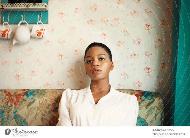 African American woman with short hair lifestyle resting female african american relax apartment comfort home sitting ethnic young thoughtful beautiful pretty