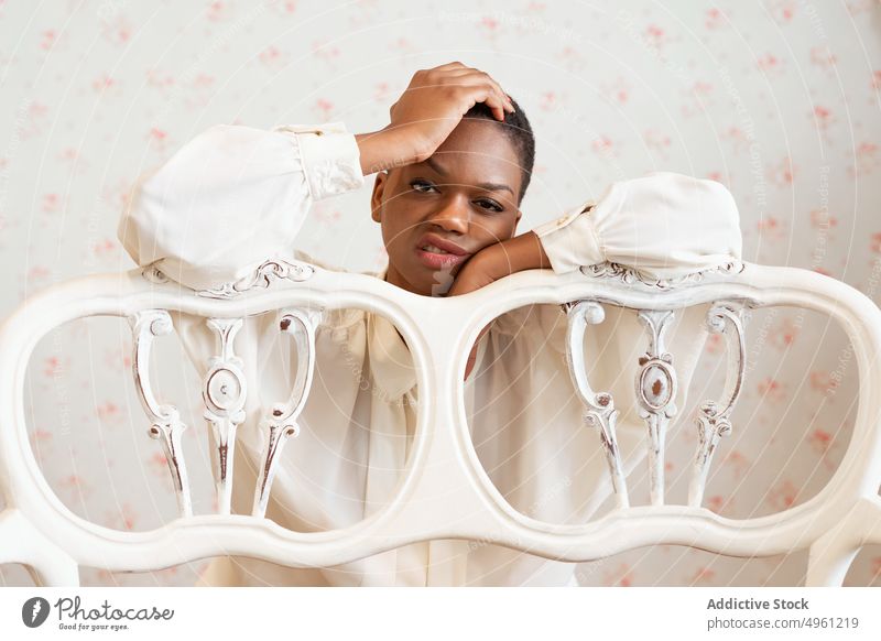 African American woman with short hair portrait disgusted lifestyle resting leaning banister female african american relax apartment comfort home ethnic young