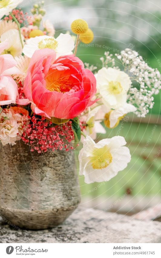 Stone vase with flowers on terrace bouquet border peony poppy summer tree natural bunch fragrant bloom weathered blossom shabby plant fresh flora lush stone