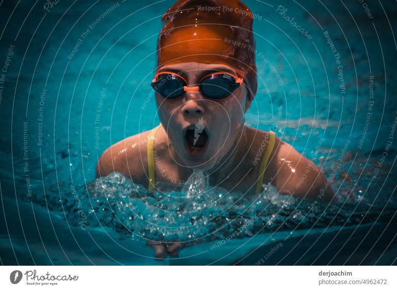 The girl gets the last out of herself to swim with powerful strokes in the pool to victory. be afloat Blue Swimming pool Summer Swimming & Bathing Refreshment