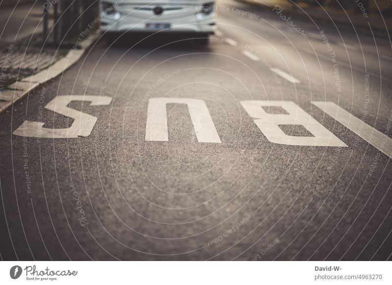 Bus in a bus lane public transportation Urban transport bus trip Road marking Street Schedule (transport) Bus stop Road traffic Passenger traffic Public transit