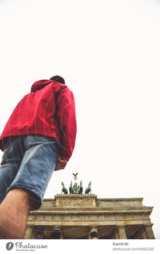 Man looking at the Brandenburg Gate Berlin Germany Capital city Landmark Tourist Attraction look at Looking Historic Monument