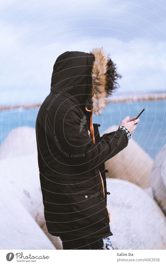 Portrait of a man against the cloudy sky using his phone Portrait photograph portrait Portrait format portraiture portrait photography portraits Man male Guy