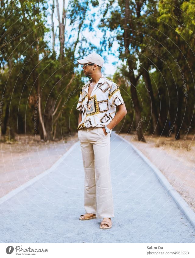 Man in a fashionable outfit posing in the city park person people Fashion trendy Trend casual Park City urban Nature Relaxation Air fresh air Fresh freshness