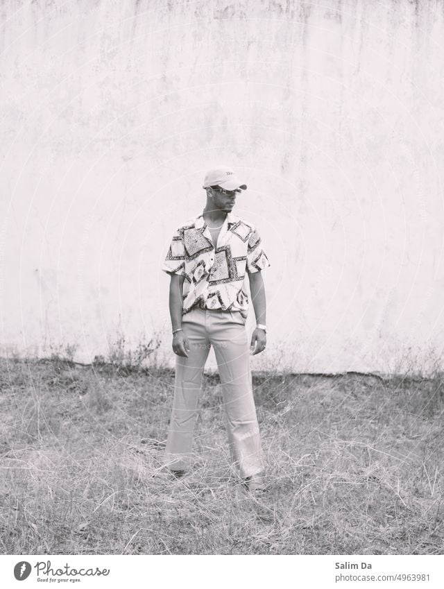 Black and white picture of a man in a fashionable outfit Fashion Style stylish Black & white photo black and white black-and-white portrait photography