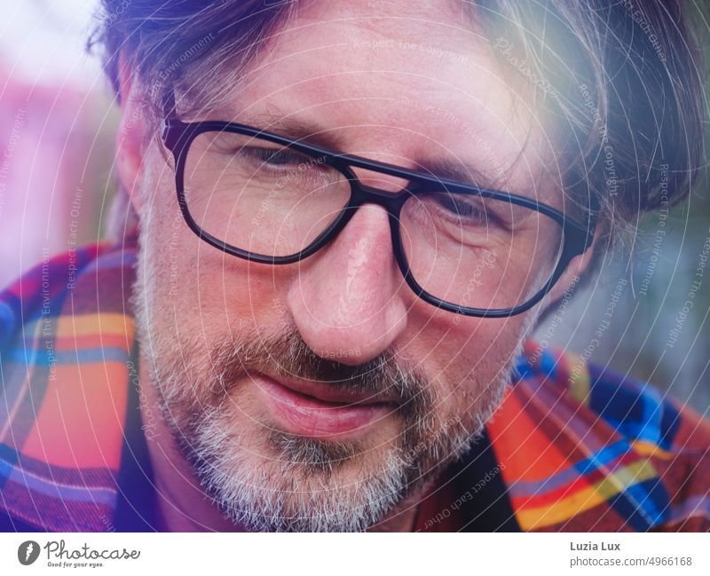 Middle-aged man wears three-day beard, black glasses and plaid shirt Smiling Man portrait Face Human being Looking Masculine Looking into the camera kind Adults