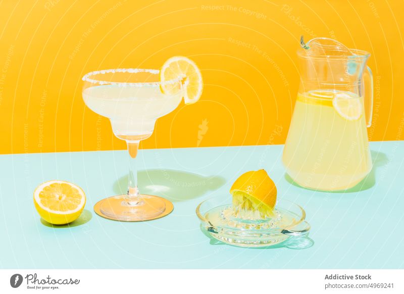 Fresh lemonade on colorful background fresh drink bright jug glass citrus beverage cool cold mexican tradition fruit refreshment juice slice vitamin healthy