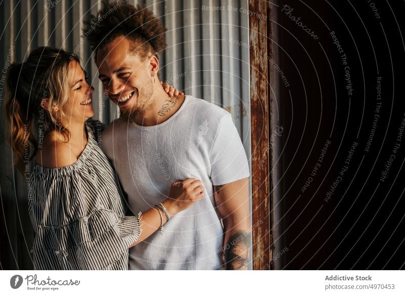 Young couple embracing in old building hug embrace love together casual male female relax lifestyle young harmony serene tender sensual relationship gentle