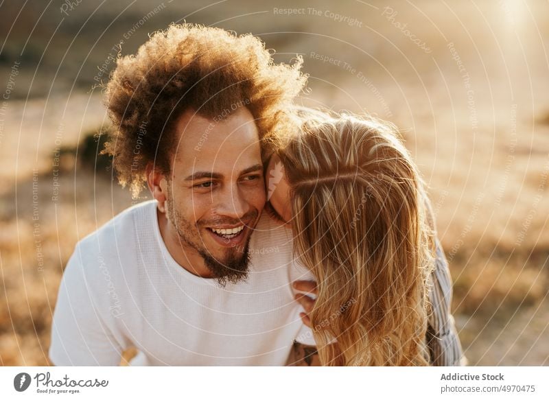 Cheerful couple embracing against highland during sunset embrace love sensual happy hill hipster romantic relationship romance affection girlfriend hug