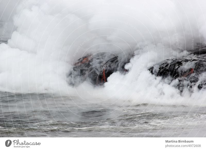 The lava glow of magma flowing in the ocean, Volcanic National Park Hawaii vapor volcano national park hawaii lava flow crashing volcanic travel fumes eruption