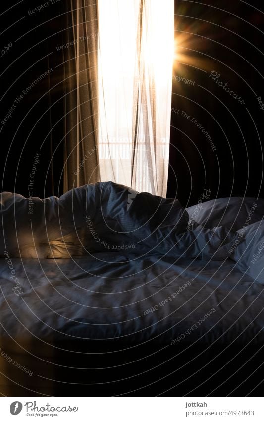 a broken, rumpled bed, the sun shines through the open curtains Bed Duvet Sleep Hotel Night Relaxation Morning Sun Sunrise Window Drape Alarm clock Wake