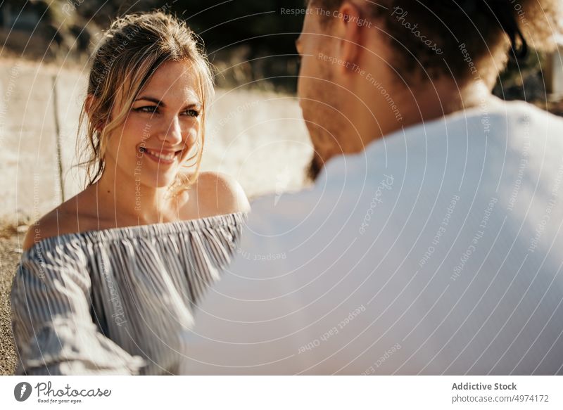 Happy young couple enjoying each other while sitting on road and embracing love hug hipster romantic sensual relationship happy street admire fondness