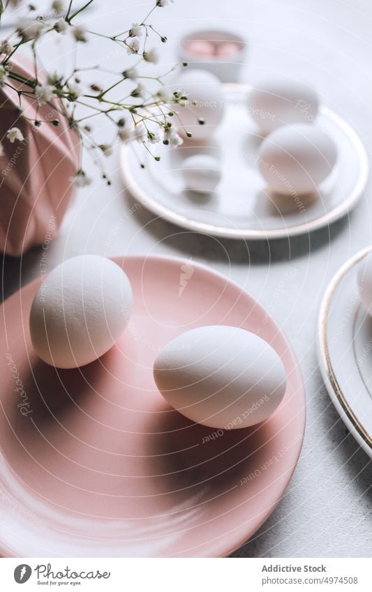 Still life of beautiful painted Easter eggs food table bowl brown colored dotted dyed easter easter egg eggshell cute flower quail pink chicken elegant