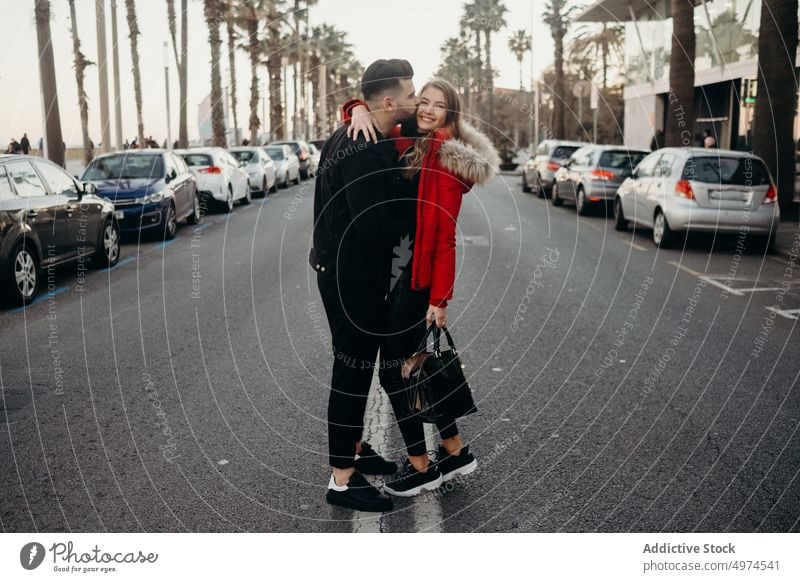 young attractive couple walking in the city urban barcelona holding hands dating man street people love woman girl female travel spain romantic beautiful modern