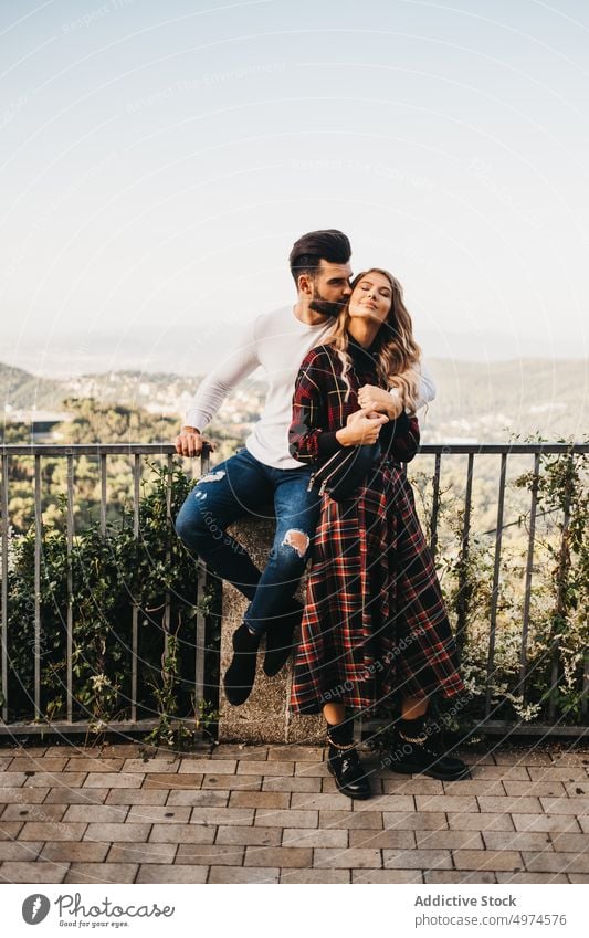 young affectionate couple in the street other walking hugging funny date trip family urban tourism catalonia spain friends handsome male spanish beautiful