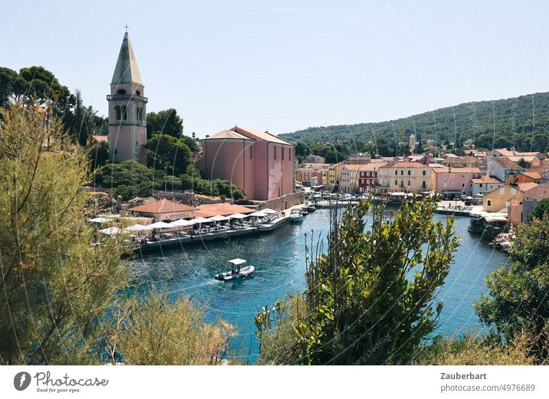 View of Veli Lošinc harbor with church, harbor basin and boat Harbour Croatia Mediterranean sea Church Ocean Dinghy Summer Vacation & Travel Tourism Bay