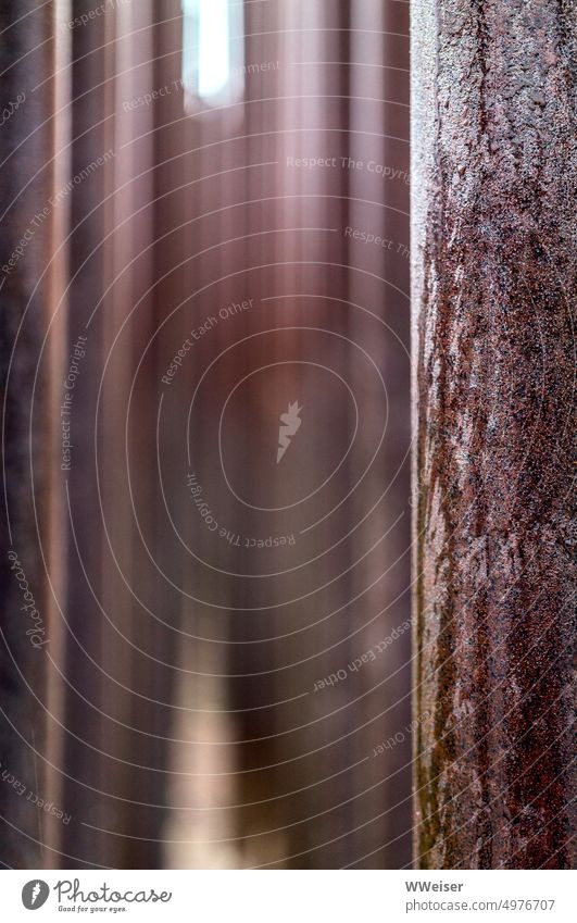 Columns of rough, rusty metal near and far Abstract Rust Weathered Metal reddishly rods series acuity blurriness upright take off Progressions Rain Surface