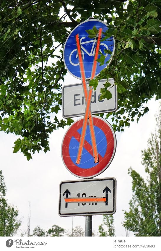 traffic signs and additional traffic signs temporarily invalidated with orange tape / road construction Road sign Additional traffic sign VZ 237 VZ 286