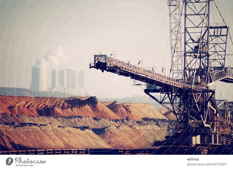 Open pit lignite mine with conveyor bridge, dumps and steam power plant open pit mining Coal hoisting crane power station Coal power station Energy industry